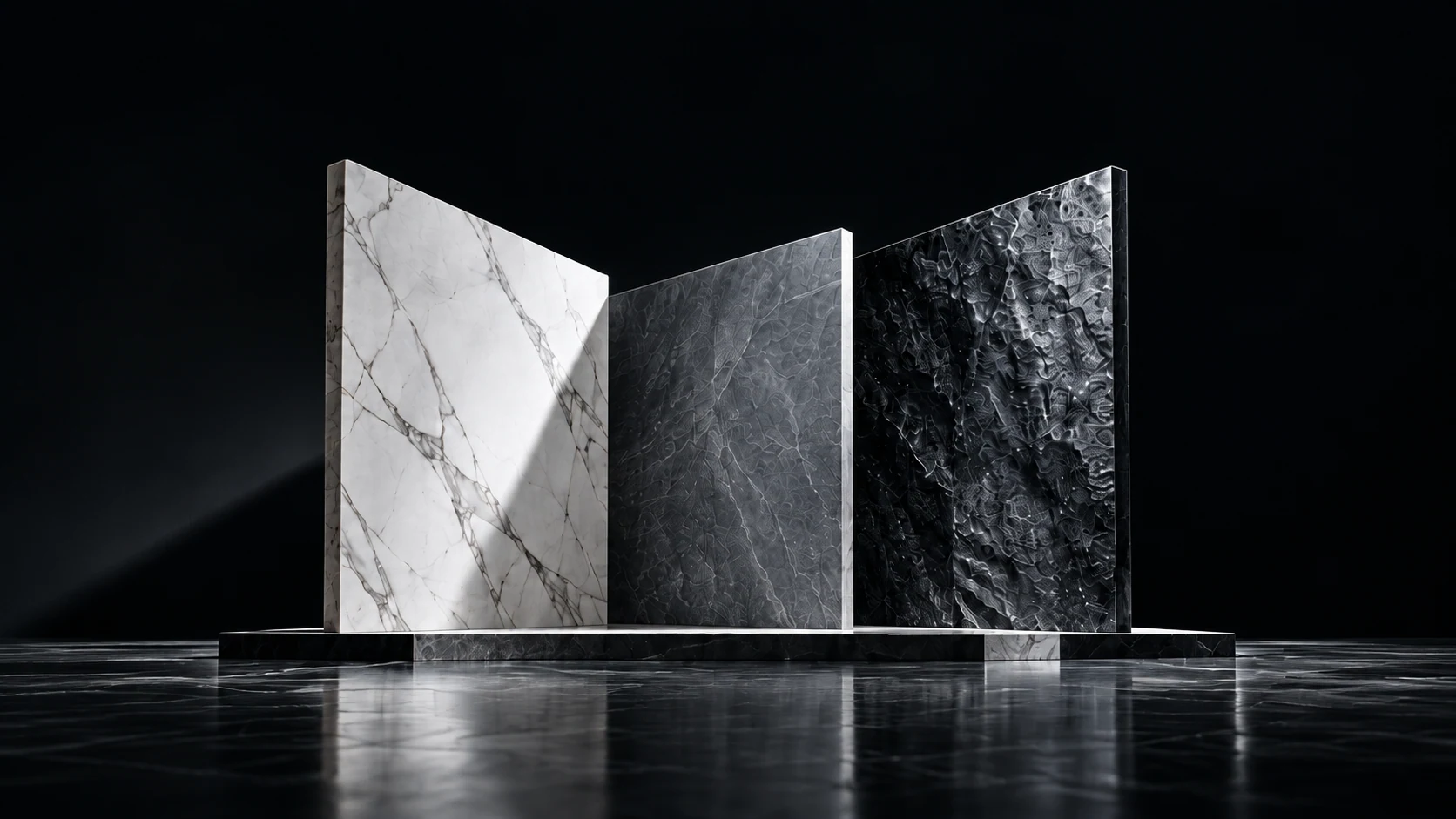 Three monumental sintered stone slabs in a black architectural studio